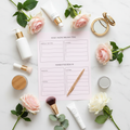 Printable beauty routine planner flat lay with skincare products, flowers and a gold pen on pastel pink background